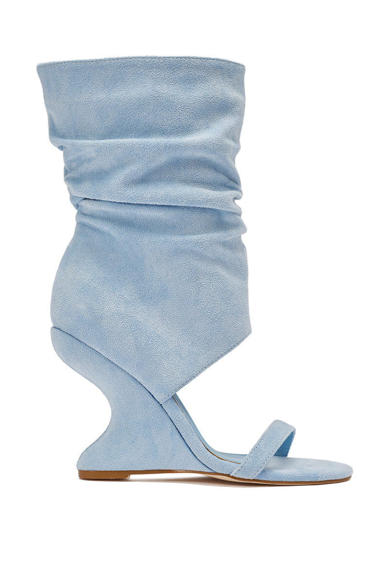 The AZALEA WANG KYVELISA BLUE WEDGE OPEN TOE BOOTIE features light blue faux suede, a comfort cushion insole, sculptural wedge heel, slouchy mid-calf shaft, and a single toe strap for modern style and all-day wear. 4