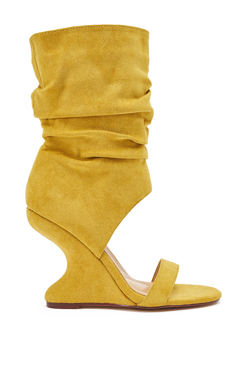 The AZALEA WANG KYVELISA MUSTARD WEDGE OPEN TOE BOOTIE is a women’s yellow faux suede bootie with a sculpted wedge heel, open toe, and slouchy ruched ankle—perfect for a chic boho look. 3