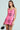 A woman in an ELLE TWEED MINI DRESS stands against a plain background, channeling her 