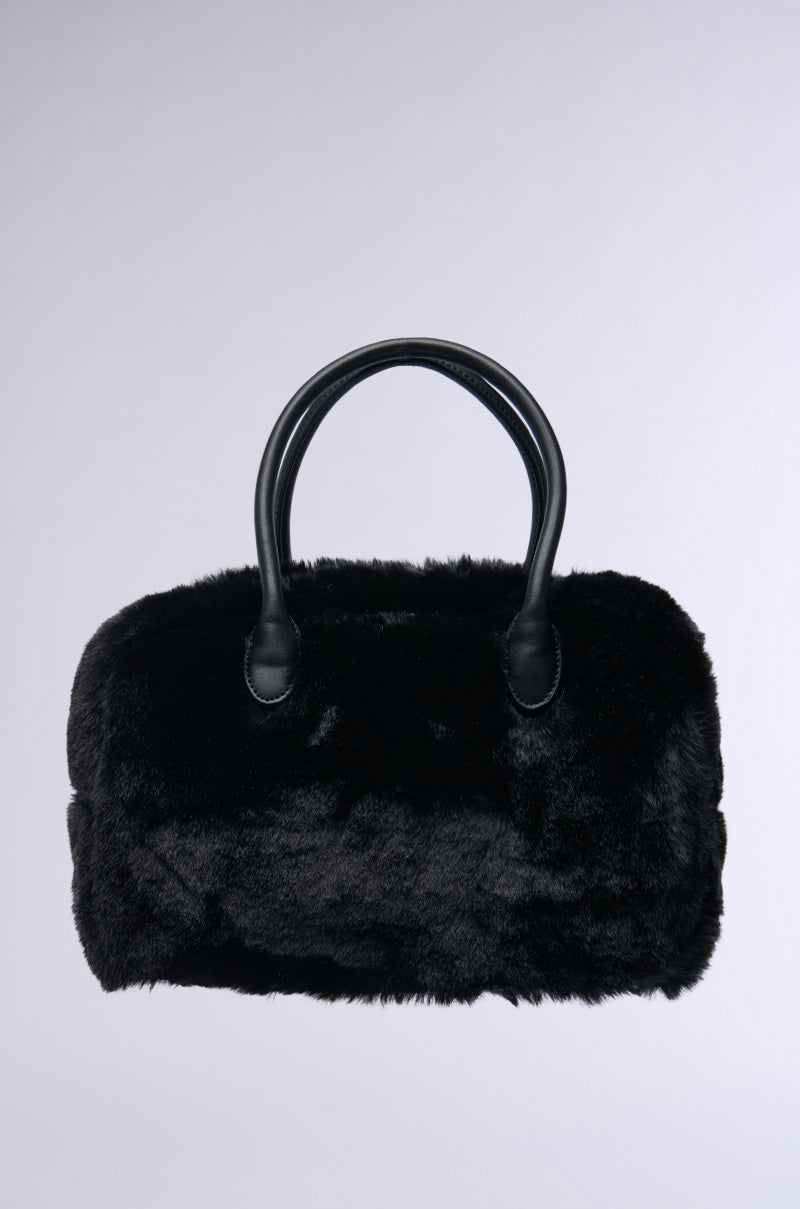 Introducing the TOO FURRY TO CARE FAUX FUR BAG, a stylish accessory in luxurious black that features sleek, rounded handles against a plain gray background. Its soft texture and modern design offer an elegant touch, making it the ideal complement to any sophisticated outfit.