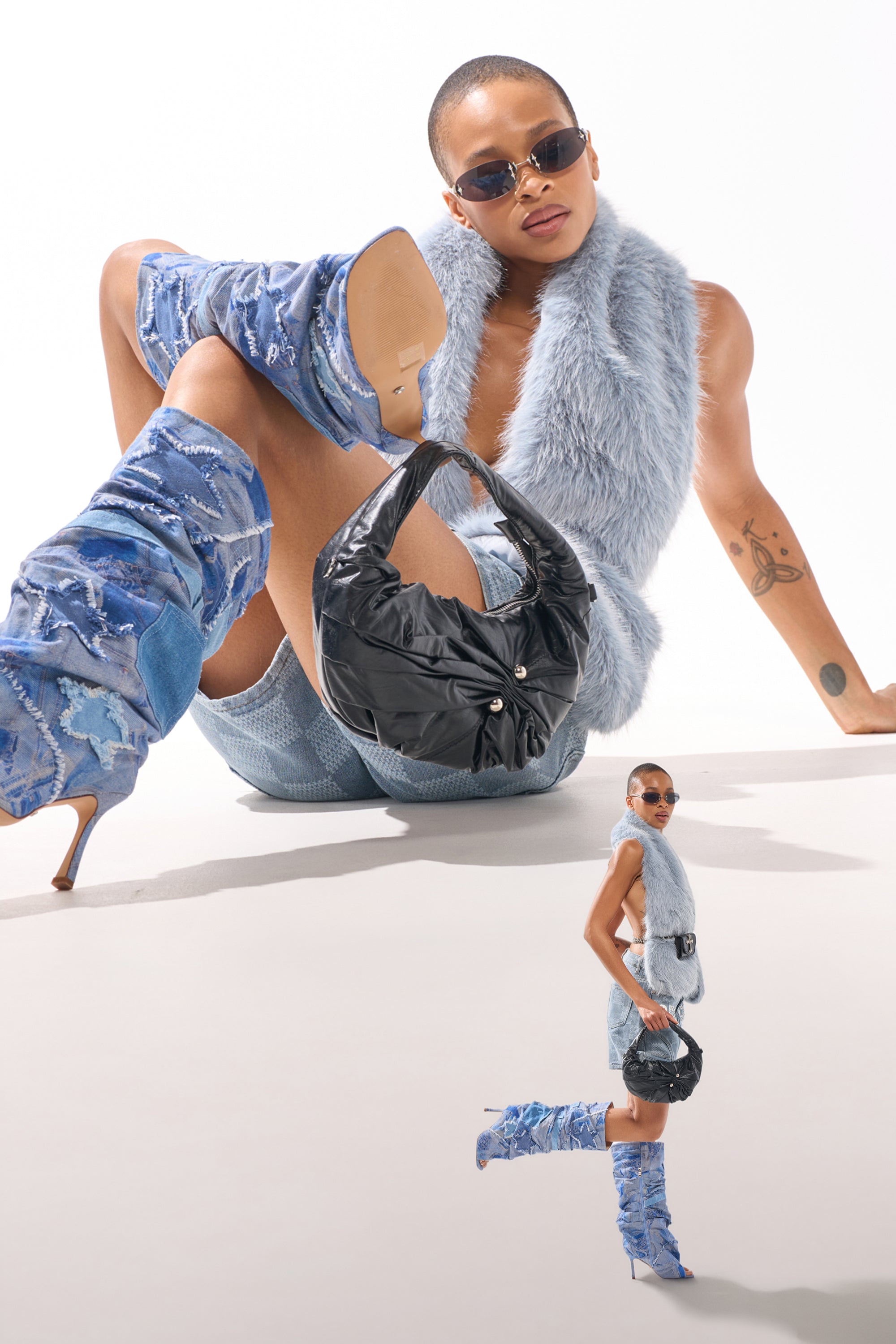A stylish person in a blue furry vest, mini skirt, sunglasses, and tall blue boots poses confidently with the NEW PIERCING PURSE. A smaller version of them stands in the foreground on a white background. 0