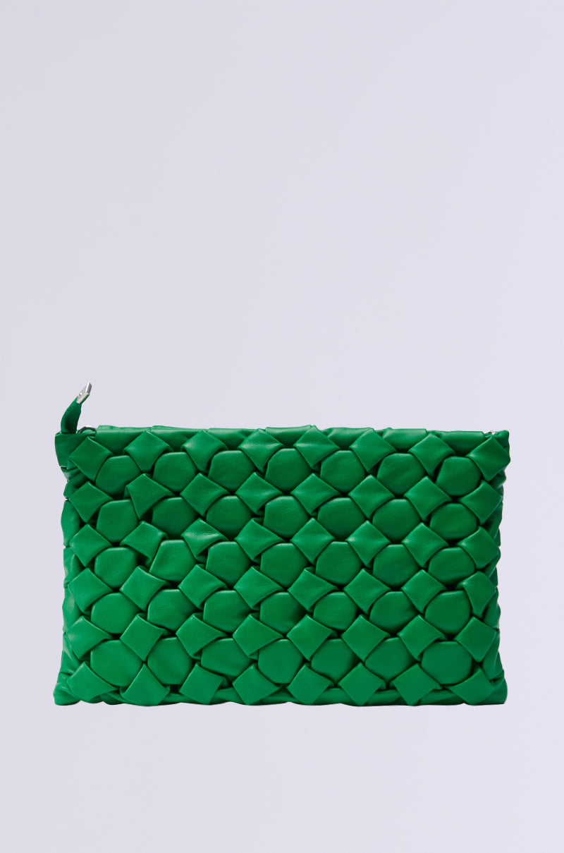 Introducing the WEAVING MY WAY CLUTCH: a chic green faux leather accessory featuring an elegant woven pattern set against a plain light gray backdrop. Its intricate design offers a textured appearance, making this clutch a stylish and modern choice for any occasion.