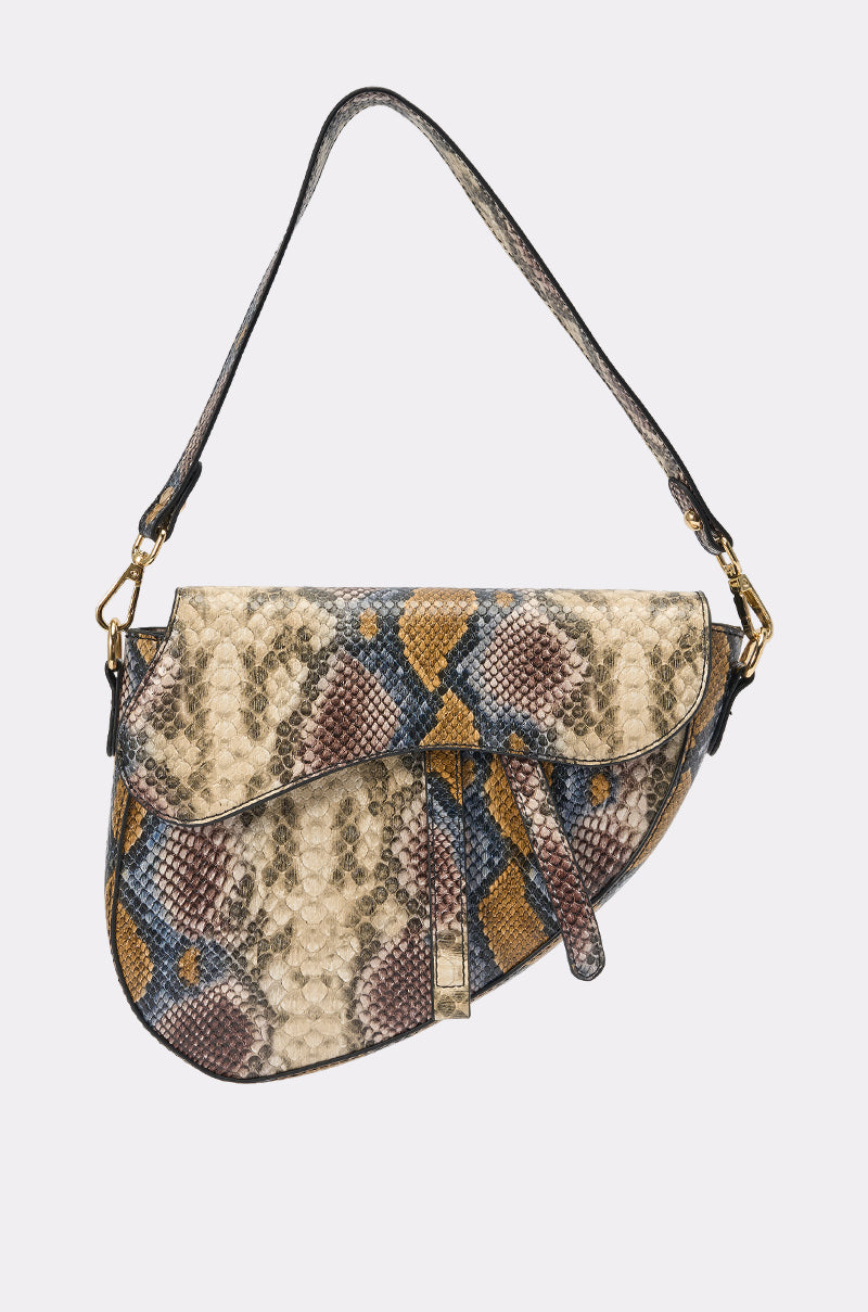 The DO U GET IT PURSE is a small faux leather snakeskin bag with a flap closure, top handle, and crossbody strap. It showcases a multicolored pattern in beige, brown, blue, and purple for versatile styling options. 2