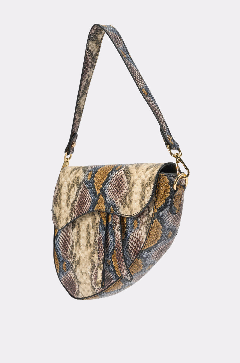 The DO U GET IT PURSE is a saddle-shaped shoulder bag with a flap closure, featuring beige, brown, blue, and yellow faux leather snakeskin, a matching textured strap, and gold hardware for an elegant touch. 3