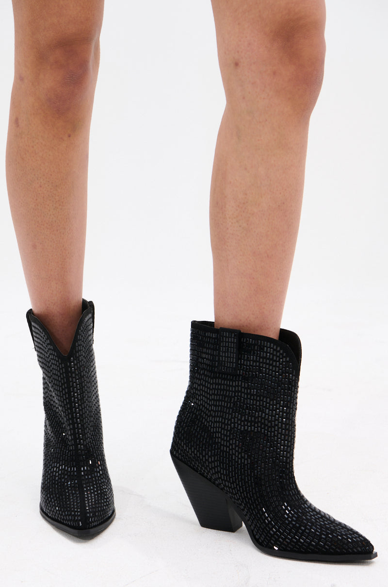 A pair of AZALEA WANG LAETITIA BLACK SPARKLE COWBOY BOOTIES features pointed toes, angled heels, and a textured suede upper for a glamorous effect. The photo highlights these rhinestone boots on a plain white background. 0