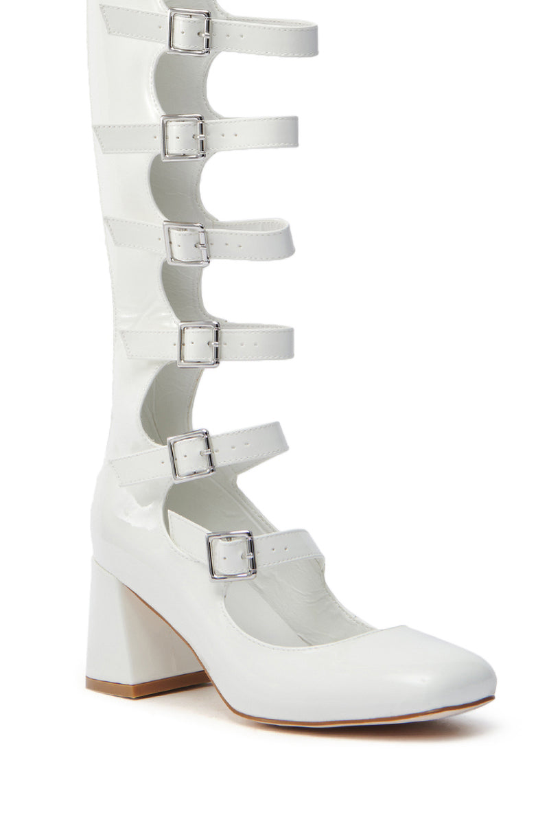 The AZALEA WANG LAIMA WHITE PATENT CHUNKY BUCKLE BOOT is a stylish, knee-high boot with an almond toe and multiple adjustable buckles. It features a glossy finish and chunky mid-heel, blending modern design with vintage flair. 6