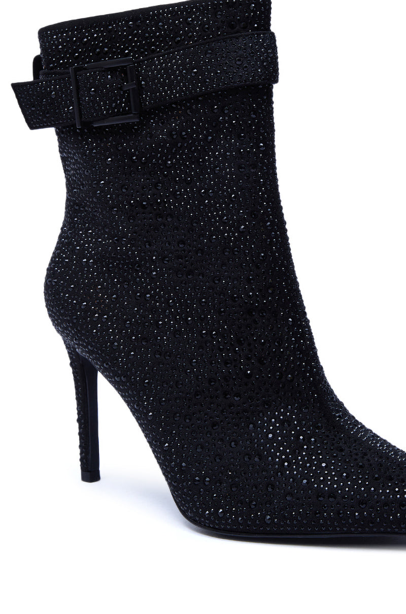 The AZALEA WANG LAKSHMI BLACK SPARKLE RHINESTONE STILETO BOOTIE features a pointed toe, sparkling rhinestone embellishments, and a decorative strap with a square buckle for added elegance.