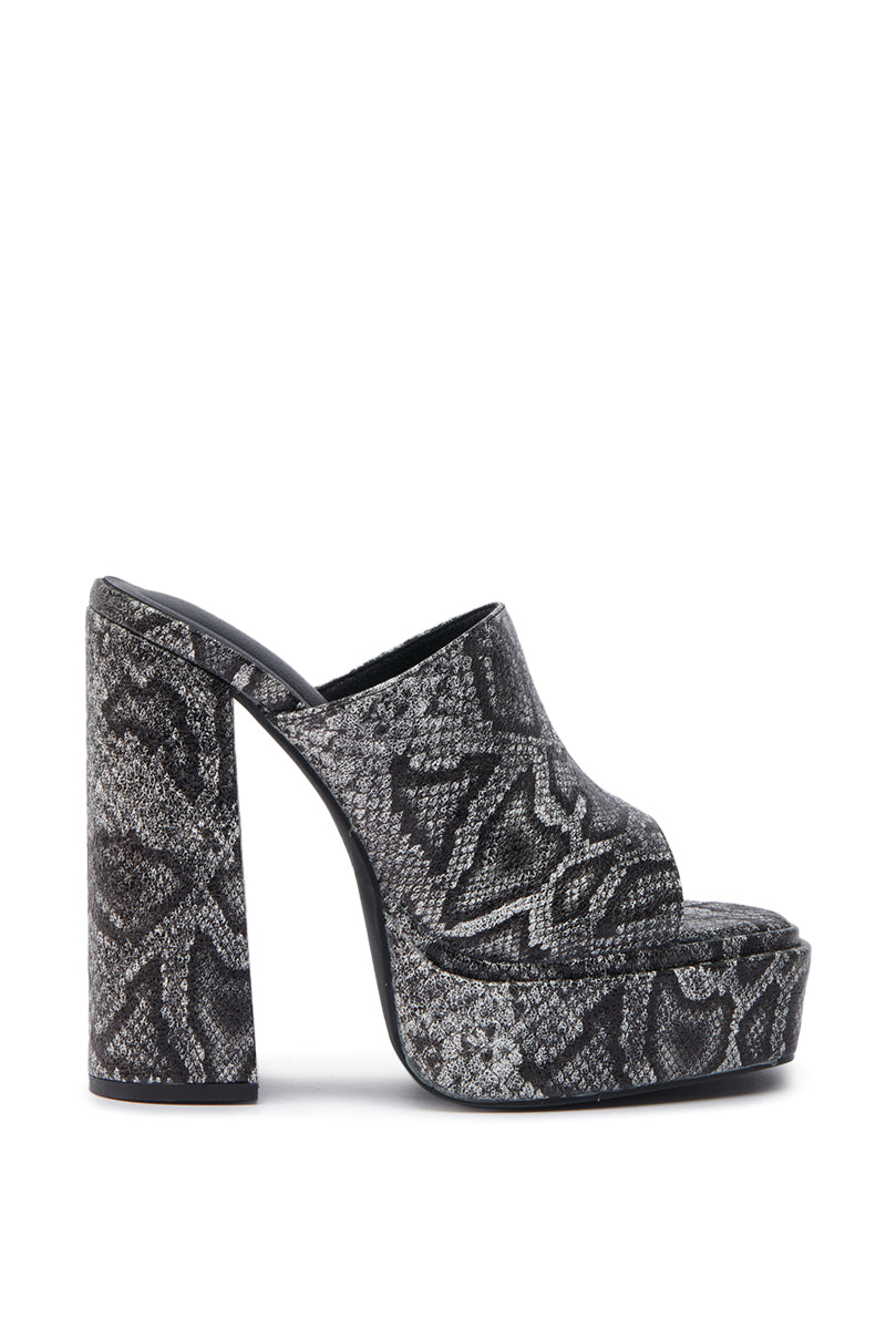 The AKIRA LAMONT SNAKE SANDAL CHUNKY PLATFORM is a high-heeled, open-toe mule with a chunky platform and heel, crafted in gray and black faux snakeskin leather with an easy slip-on design.