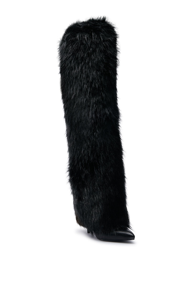 The AZALEA WANG LANGDON BLACK BOOT is a tall, black thigh-high boot enveloped in plush fur, showcasing a pointed toe and sleek design with a stiletto heel. Displayed against a plain white background, this striking piece exudes elegance.