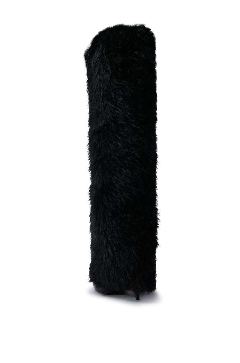 The AZALEA WANG LANGDON BLACK BOOT, a thigh-high boot with a high cylindrical shape, is crafted from luxurious black fur with a fluffy texture and stands out against a plain white background.