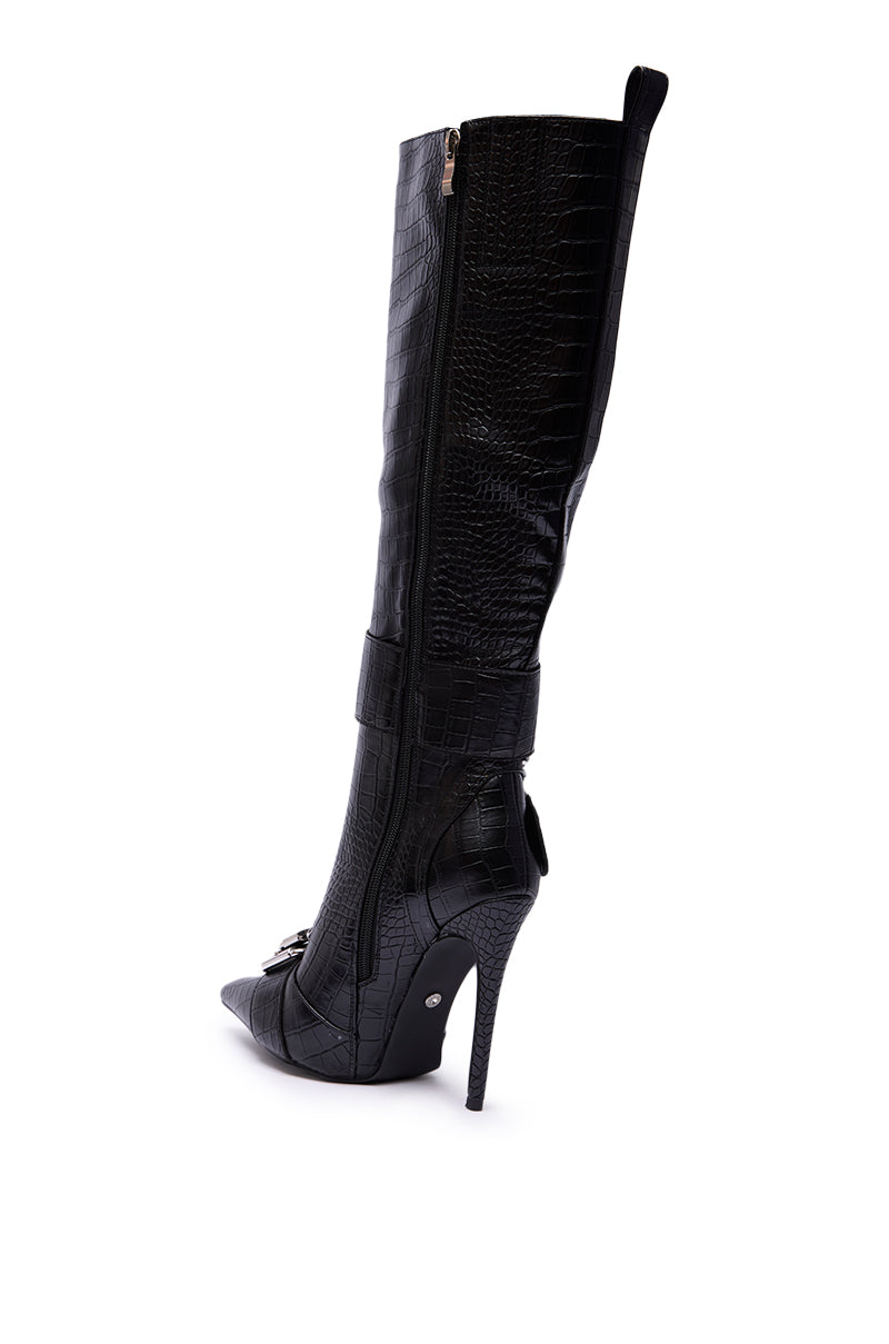 The AZALEA WANG LAPIS BLACK SNAKE STILETTO BOOT features a tall silhouette, pointed toe, crocodile texture, side zipper, decorative buckles, and slim stiletto heel, strikingly photographed on a white background.