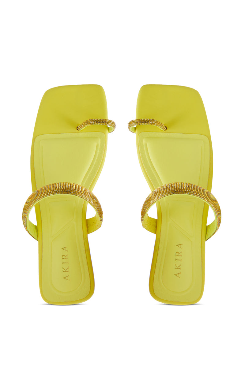 The AKIRA LAVEDA YELLOW EMBELLISHED FLAT SANDAL features rhinestone-encrusted double straps on neon yellow faux leather square-toe flats, with "AKIRA" printed on the insole.