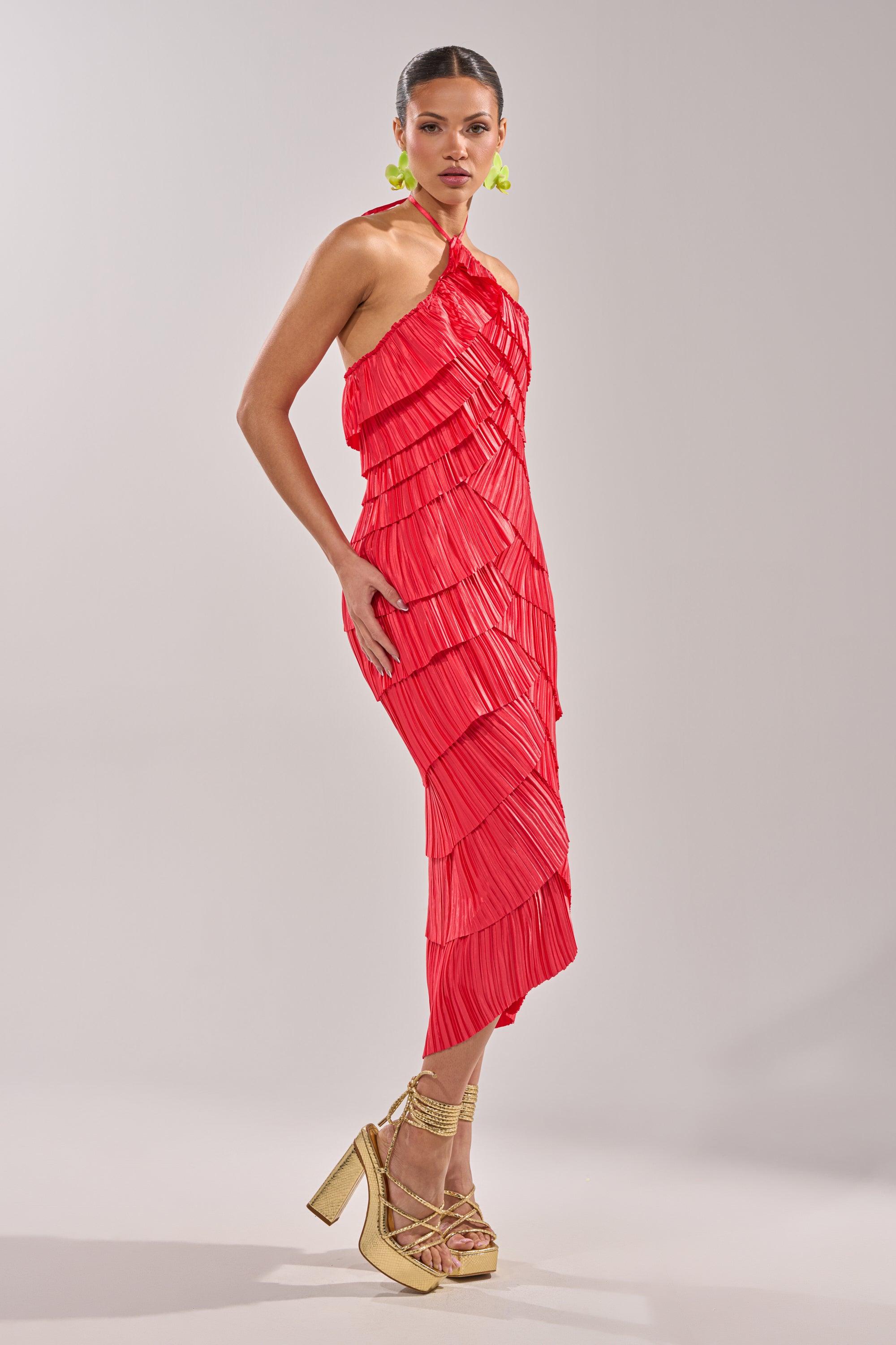 A woman wearing the GIVE IT TO ME BABY SATIN MAXI DRESS, a red pleated maxi dress. 3