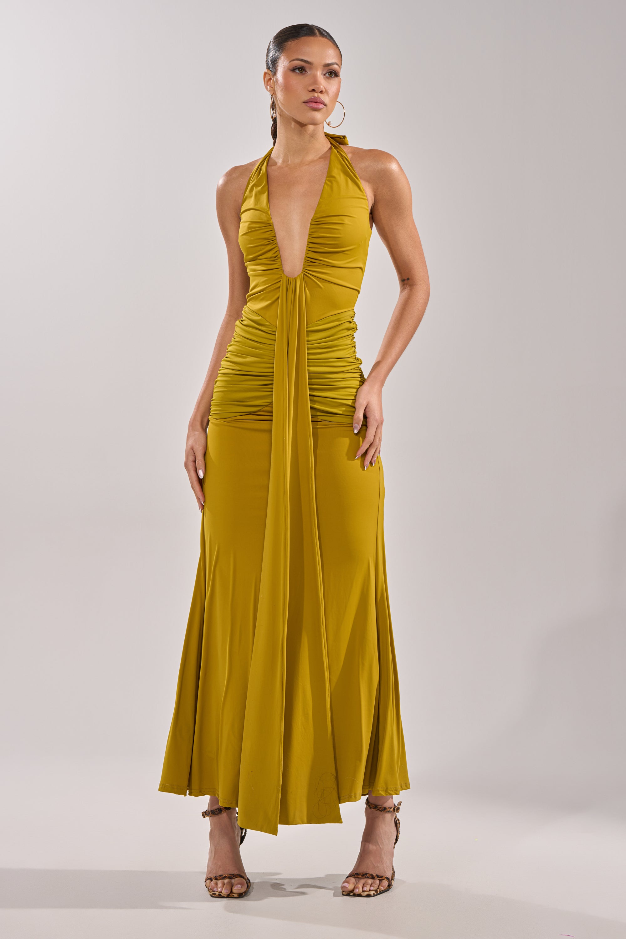 A woman in the ISLAND LOVE MAXI DRESS IN GREEN. 5