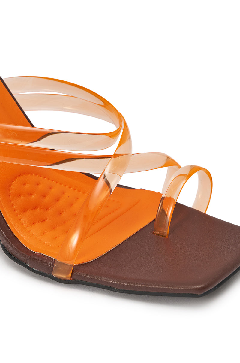 Close-up of the AZALEA WANG LEMUEL BROWN AND ORANGE WEDGE SANDAL, featuring a brown square open toe, cushioned orange insole, and three transparent orange straps crossing over the foot. 6