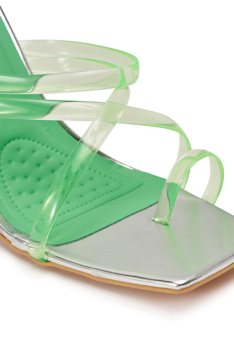 Close-up of the AZALEA WANG LEMUEL Green and Silver Wedge Sandal with transparent green straps, a green cushioned dotted insole, and a squared silver metallic toe. 6