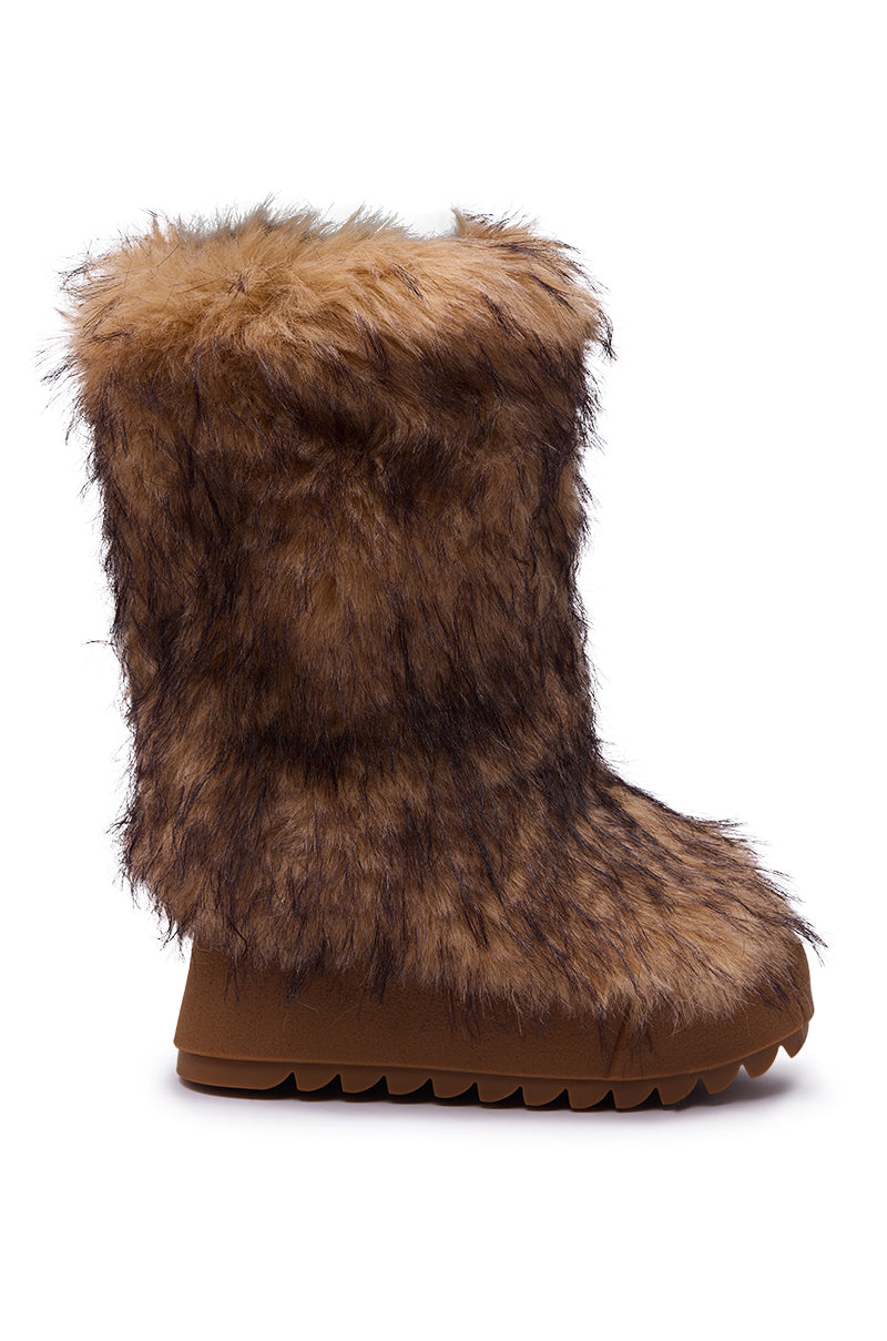 The AZALEA WANG LEOPOLD BROWN MULTI FLAT FUR BOOT features a shaggy, animal-like faux fur design with a rugged platform lug sole, shown as a single brown boot against a white background.