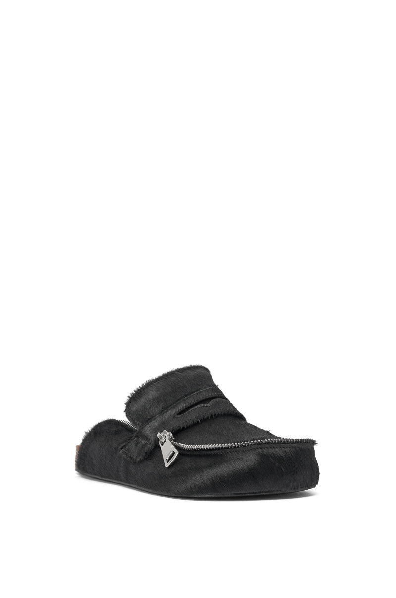 The AZALEA WANG LIMERICK BLACK METAL EMBELLISHMENT FLAT is a black, backless mule with a furry calf-hair texture and a prominent silver zipper detail, displayed on a plain white background. 3
