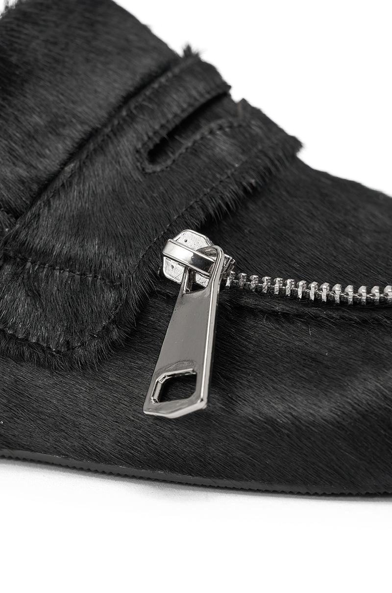 Close-up of the AZALEA WANG LIMERICK BLACK METAL EMBELLISHMENT FLAT, a black slip-on shoe with textured material, a partially unzipped metallic zipper, and detailed stitching around the zipper and strap. 6