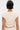 Seen from the back, a person with short black hair and a blonde streak wears the SYDNEY TEXTURED BLOUSE and matching bottoms; its chic ruched texture and relaxed style highlight their look as a tattoo peeks from their upper left arm.