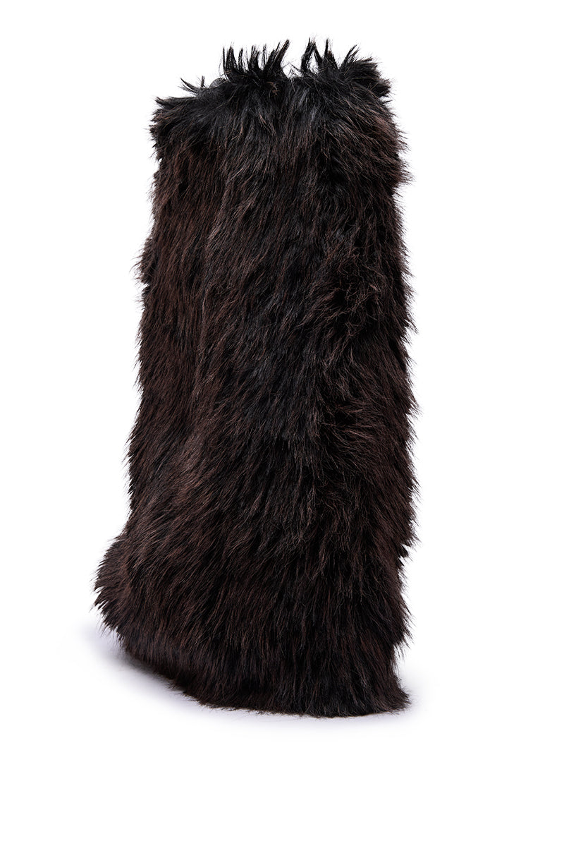 The AZALEA WANG LISBOA BROWN FUR FOLD OVER BOOT, a tall, rectangular boot with long, shaggy dark brown faux fur, stands upright against a white background.