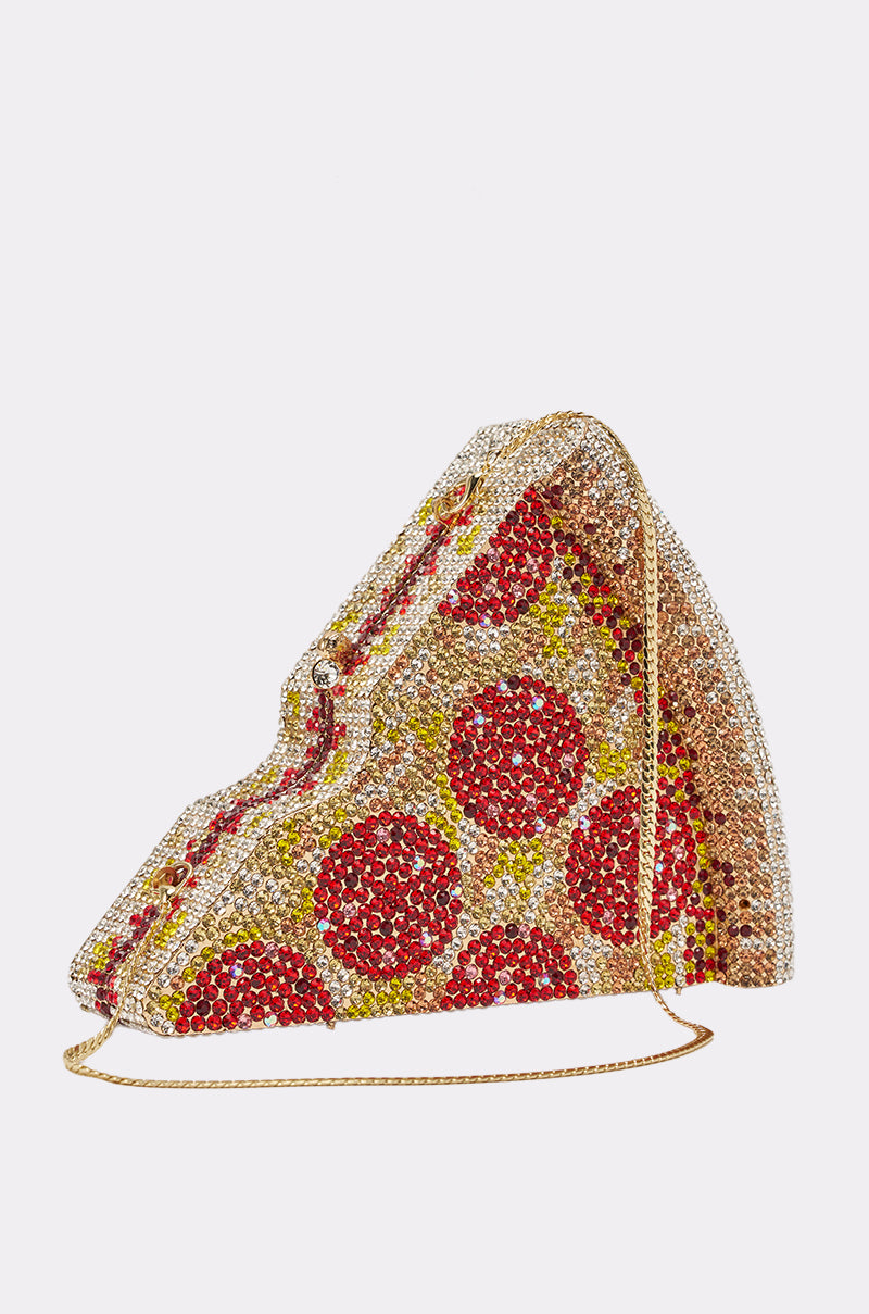The GRAB A SLICE RHINESTONE PIZZA CLUTCH is a sparkling novelty handbag shaped like a pepperoni slice, adorned in red, gold, and silver crystals with a thin gold chain strap. 2