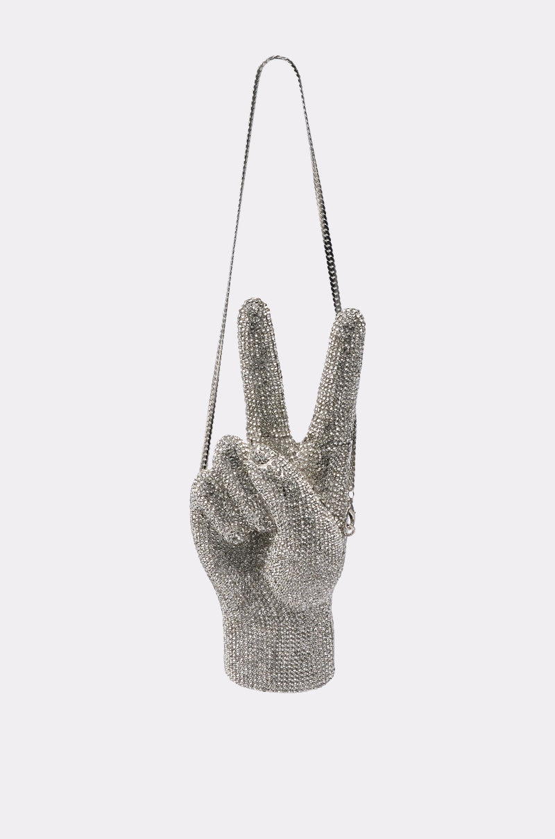 The PEACE BLING PURSE is a novelty handbag shaped like a rhinestone-studded peace sign hand with a thin shoulder strap, shown against a plain light background. 0