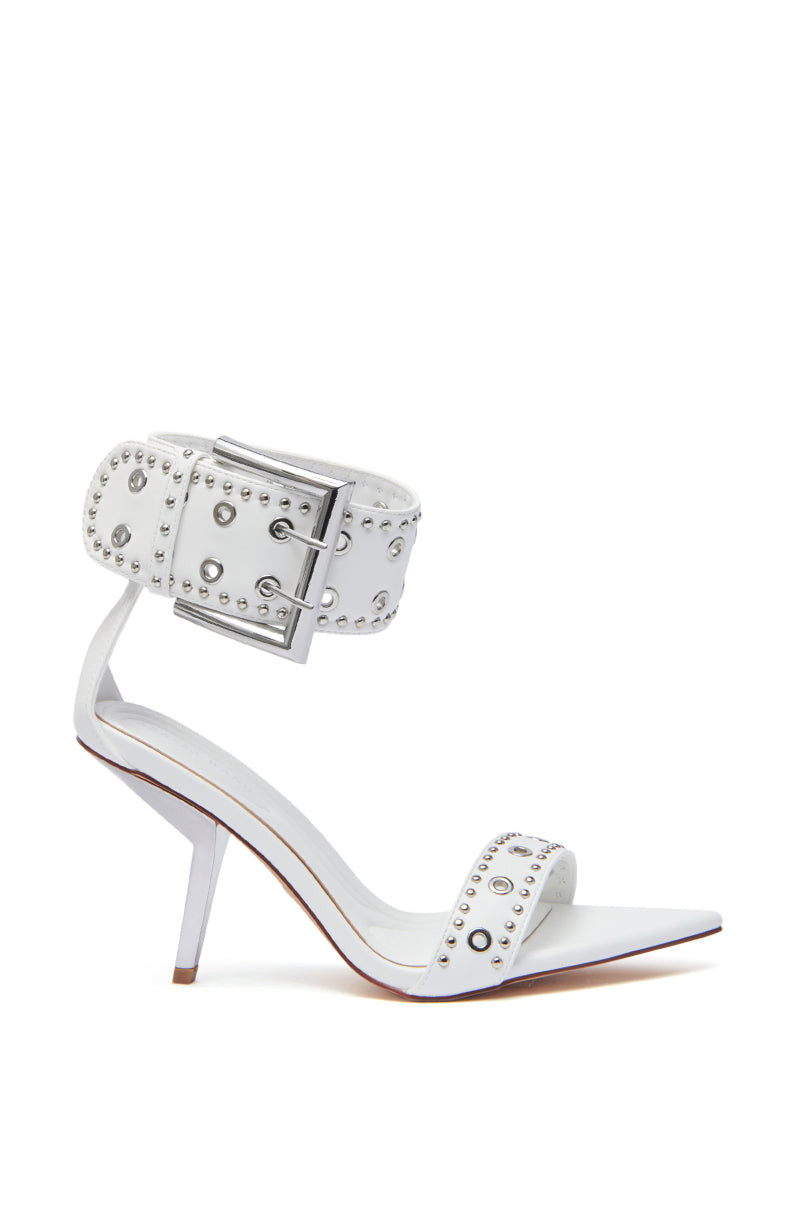The AZALEA WANG LOBELIA WHITE HARDWARE DETAIL SANDAL features faux leather, a stiletto heel, wide ankle and toe straps with silver studs, eyelets, and a bold silver buckle for modern style.