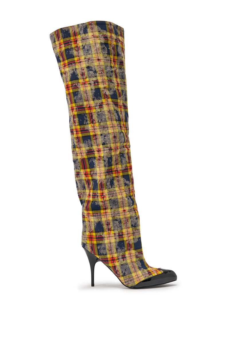 The AKIRA WANG LOCHANA Multi Yellow Plaid Flannel Sexy Boot is a single thigh-high stiletto with a pointed toe and a yellow, red, and black plaid pattern, shown against a white background. 4