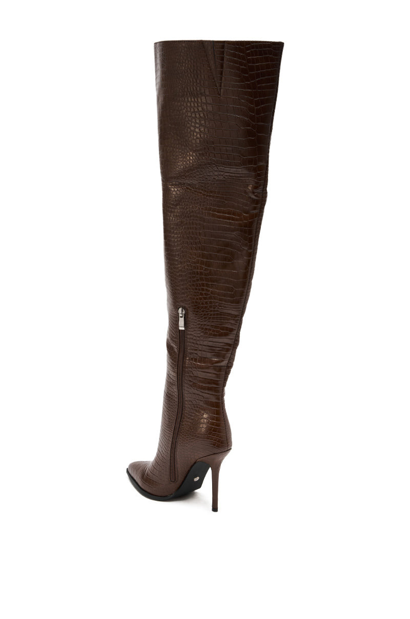 The AZALEA WANG LORAH CROC BROWN BOOT is a single brown, over-the-knee, crocodile-textured stiletto thigh high with a side zipper, displayed in profile on a white background.