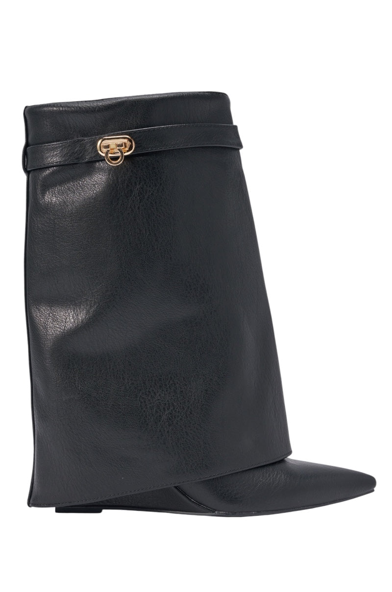 The AZALEA WANG LOUISA BLACK PU WEDGE BOOTIE is a black faux leather bootie with a wide, angular foldover shaft and a small gold buckle near the top. 2