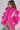 A person with braided hair wears the LOVERBOY Faux Fur Moto Jacket in a vibrant pink shade, featuring metallic silver accents, paired with leopard print pants. They pose against a plain background.