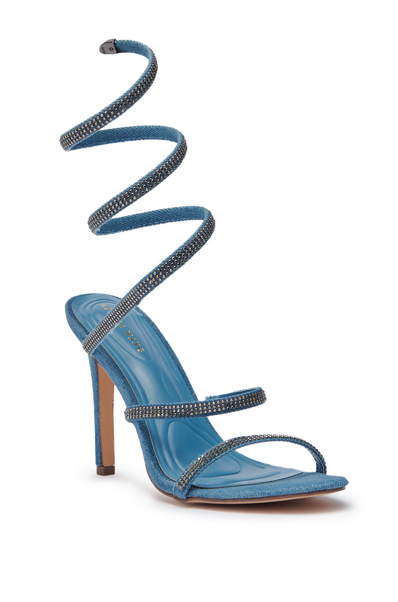 The AZALEA WANG LOWRI DENIM SPARKLE COIL WRAP UP SANDAL features blue denim, two front straps, a rhinestone-studded spiral ankle strap, and a slim stiletto heel for standout sparkle and elegant style. 4