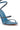 A close-up of the AZALEA WANG LOWRI DENIM SPARKLE COIL WRAP UP SANDAL, a blue denim stiletto with three rhinestone-embellished straps, cushioned insole, open toe, and a striking spiral ankle strap.