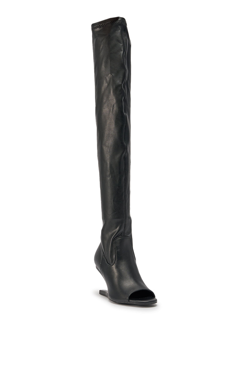 The AZALEA WANG LUMI BLACK OVER THE KNEE OPEN TOE WEDGE BOOT features a black faux leather design with a slightly wrinkled shaft, open toe, and wedge sole, shown against a plain white background. 4
