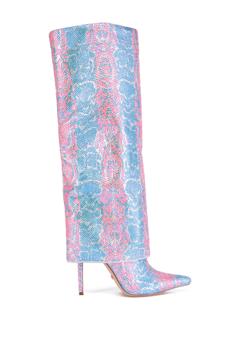 The AZALEA WANG LUXER PINK AND BLUE MULTI RHINESTONE BOOT is a knee-high boot featuring a pointed toe, stiletto heel, and a vibrant snakeskin pattern in shades of blue, pink, and white.