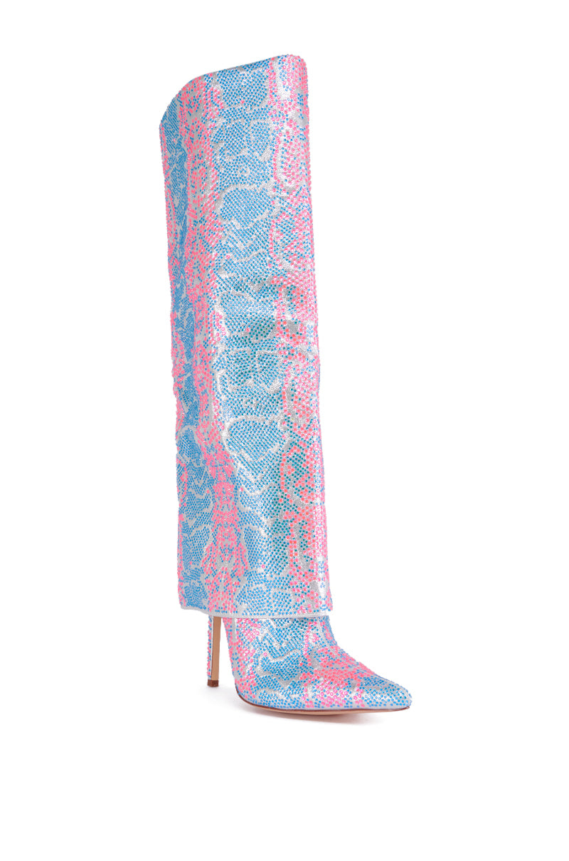 The AZALEA WANG LUXER PINK AND BLUE MULTI RHINESTONE BOOT is a knee-high stiletto boot featuring a vibrant snakeskin pattern in blue, pink, and white hues. The boot boasts a pointed toe and a slim, high stiletto heel for a bold and stylish look.