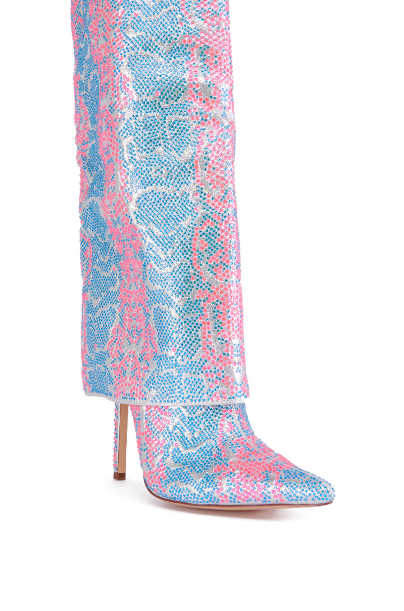 A close-up image of the AZALEA WANG LUXER PINK AND BLUE MULTI RHINESTONE BOOT showcasing a vibrant snakeskin pattern in blue, pink, and white. This stylish boot features a pointed toe and a thin stiletto heel adorned with rhinestones.