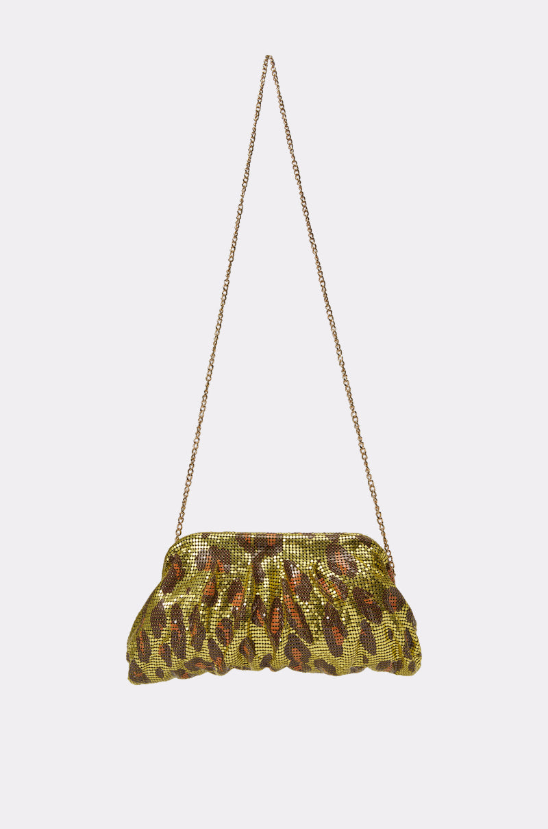 The TAKE A TRIP CHAINMAIL CLUTCH is a small, ruched evening bag featuring a metallic gold and brown leopard print, gold chain strap, and is displayed against a plain white background. 3