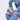 Wearing a light blue denim jacket and jeans, a person sits holding the LOVE MY VIBE HAMMERED CHROME PURSE, showcasing its textured hammered finish and stylish crossbody fit. Only their torso and legs are visible.