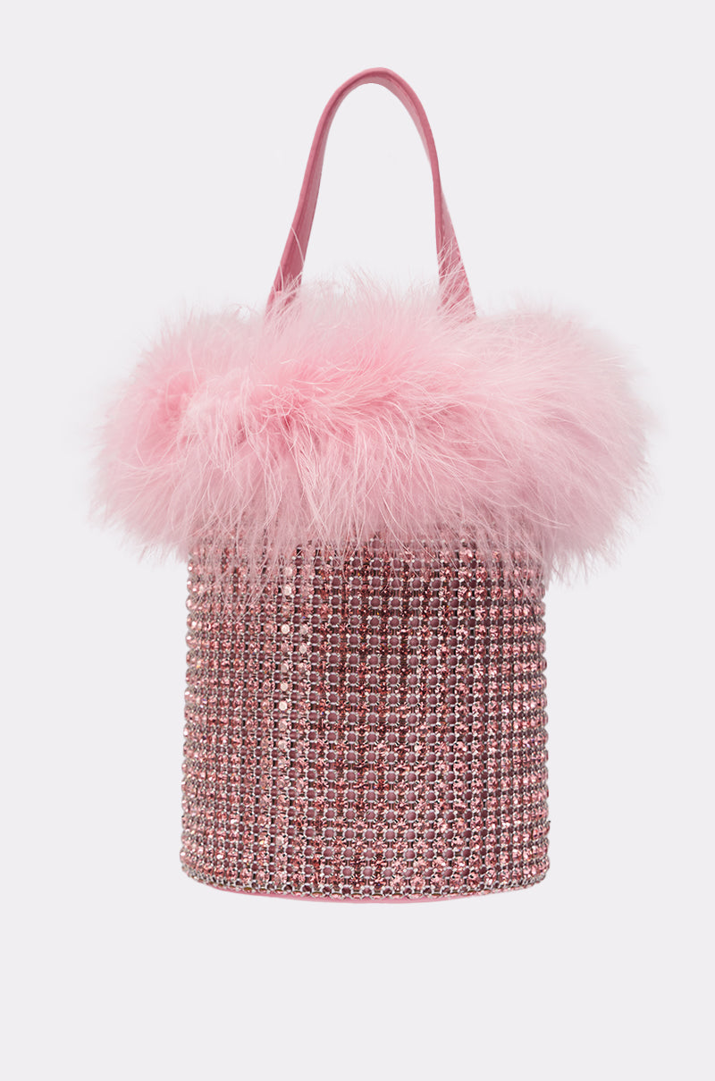 Introducing the ELLE PINK FEATHER BLING PURSE—a cylindrical pink faux leather bag adorned with sparkling rhinestones, fluffy feather trim, and a single pink handle for a glamorous look. 3