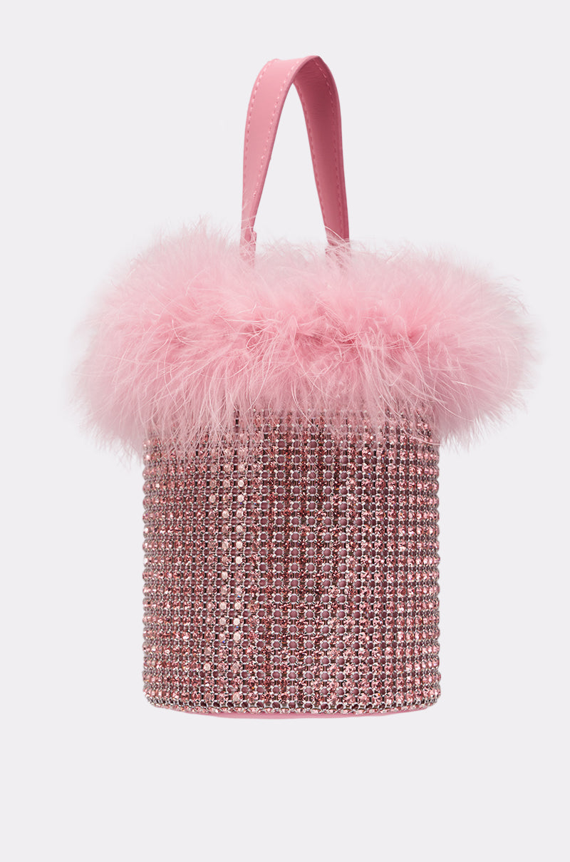 The ELLE PINK FEATHER BLING PURSE is a small pink cylindrical rhinestone handbag with a fluffy feather trim and matching handle—ideal for enhancing your feather purse collection with extra sparkle. 5