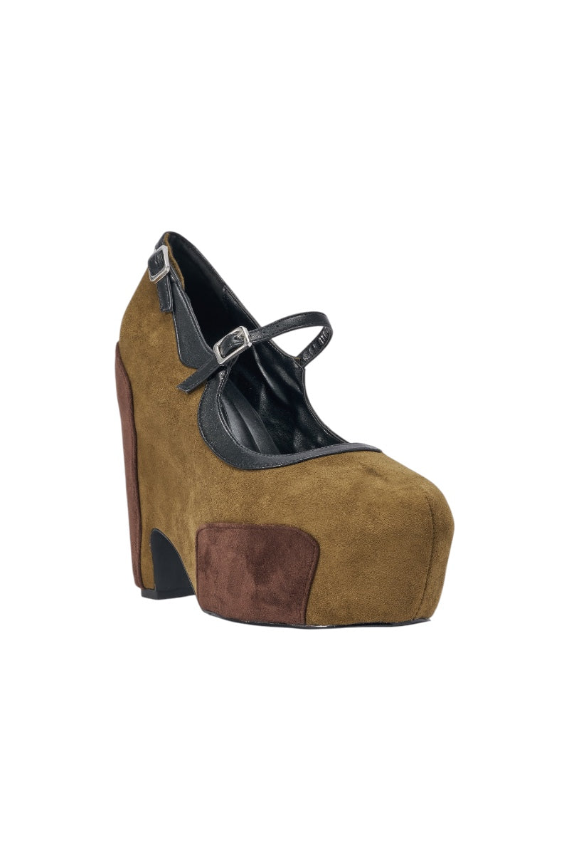 The AZALEA WANG LYTHA OLIVEMARY JANE PUMP is an olive suede platform with brown patches, black accents, and a top strap for a Mary Jane look. It features a closed toe and high, curved chunky heel for stylish flair. 3