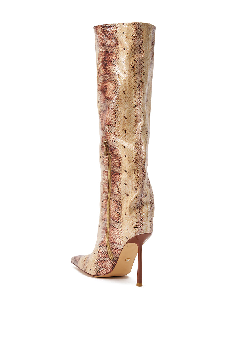 The AZALEA WANG MADEYE NUDE SNAKE STILETTO BOOT is a tall, tan and brown faux snakeskin knee-high boot with a pointed toe, side zipper, and slim stiletto heel. 9