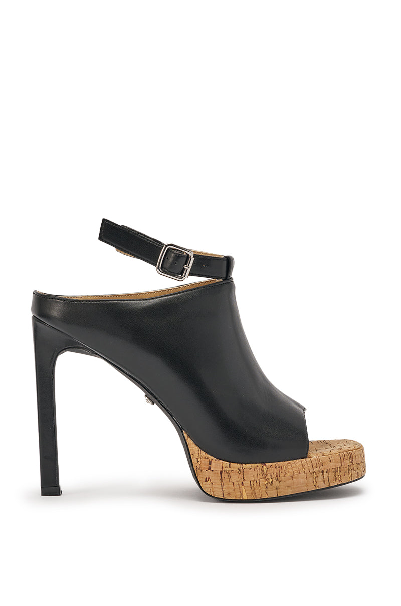 The AZALEA WANG MAELIE BLACK AND CORK STILETTO SANDAL features black faux leather, an open toe, ankle strap, and cork platform sole. It is shown in side profile against a white background. 4