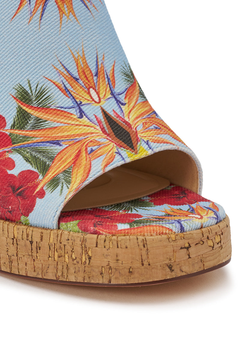 Close-up of the AZALEA WANG MAELIE MULTI FLORAL STILETTO SANDAL with a cork sole and blue fabric adorned with bold red, orange, and yellow flowers—ideal for bringing vibrant flair to summer occasions. 6