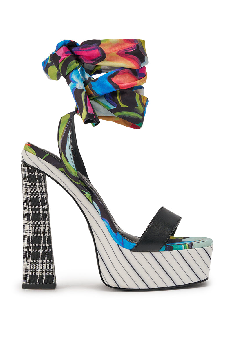 The AKIRA GOLD MAGRITTE MULTI STRIPE PRINT CHUNKY PLATFORM SANDAL features a high heel, black strap, striped sole, plaid chunky heel, and a vibrant abstract ankle wrap. 4