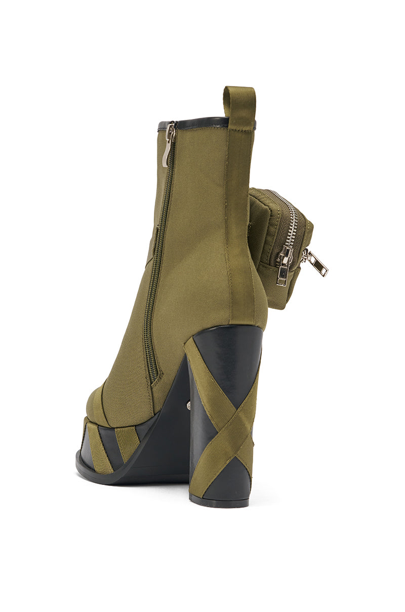 The AZALEA WANG MAHOMES OLIVE SPORTY COMBAT BLOCK BOOTIE features an olive hue, black chunky heel, crisscross straps, side zipper, open toe, and a zippered back pouch for a stylish and practical look. 6