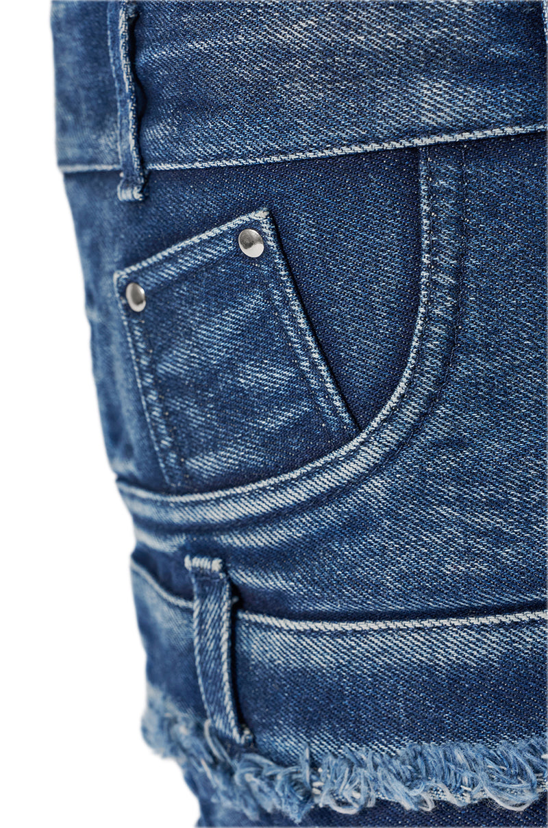 Close-up of the AKIRA GOLD MAHONEY DENIM PANT DETAIL GLADIATOR STILETTO’s back pocket, highlighting detailed stitching, metal rivets, and a frayed hem. 8