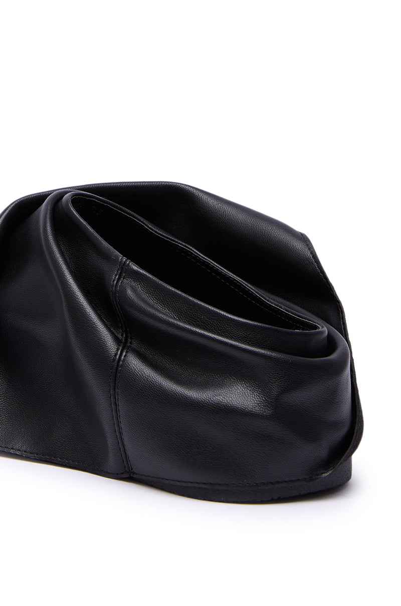 A black, soft leather handbag with a folded, sculptural design is set against a white background—perfect for pairing with chunky flat soles or your favorite AZALEA WANG MAITYE BLACK RUCHED FLAT.